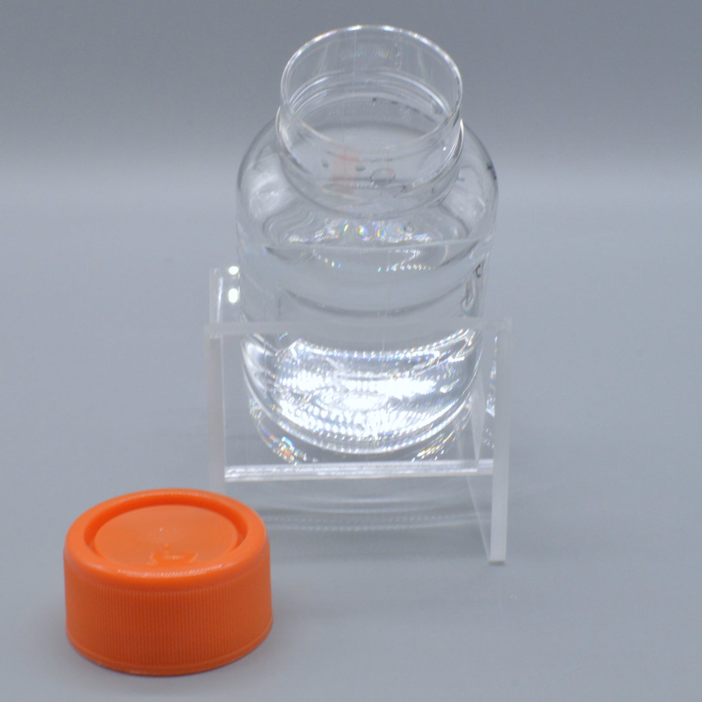 Round Media Bottle Angled Holder Inclined and Ergonomic